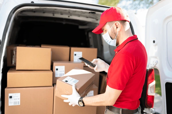 delivery-man-red-uniform-scanning-600nw-1950925006