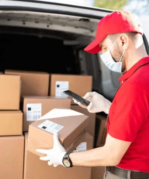 delivery-man-red-uniform-scanning-600nw-1950925006